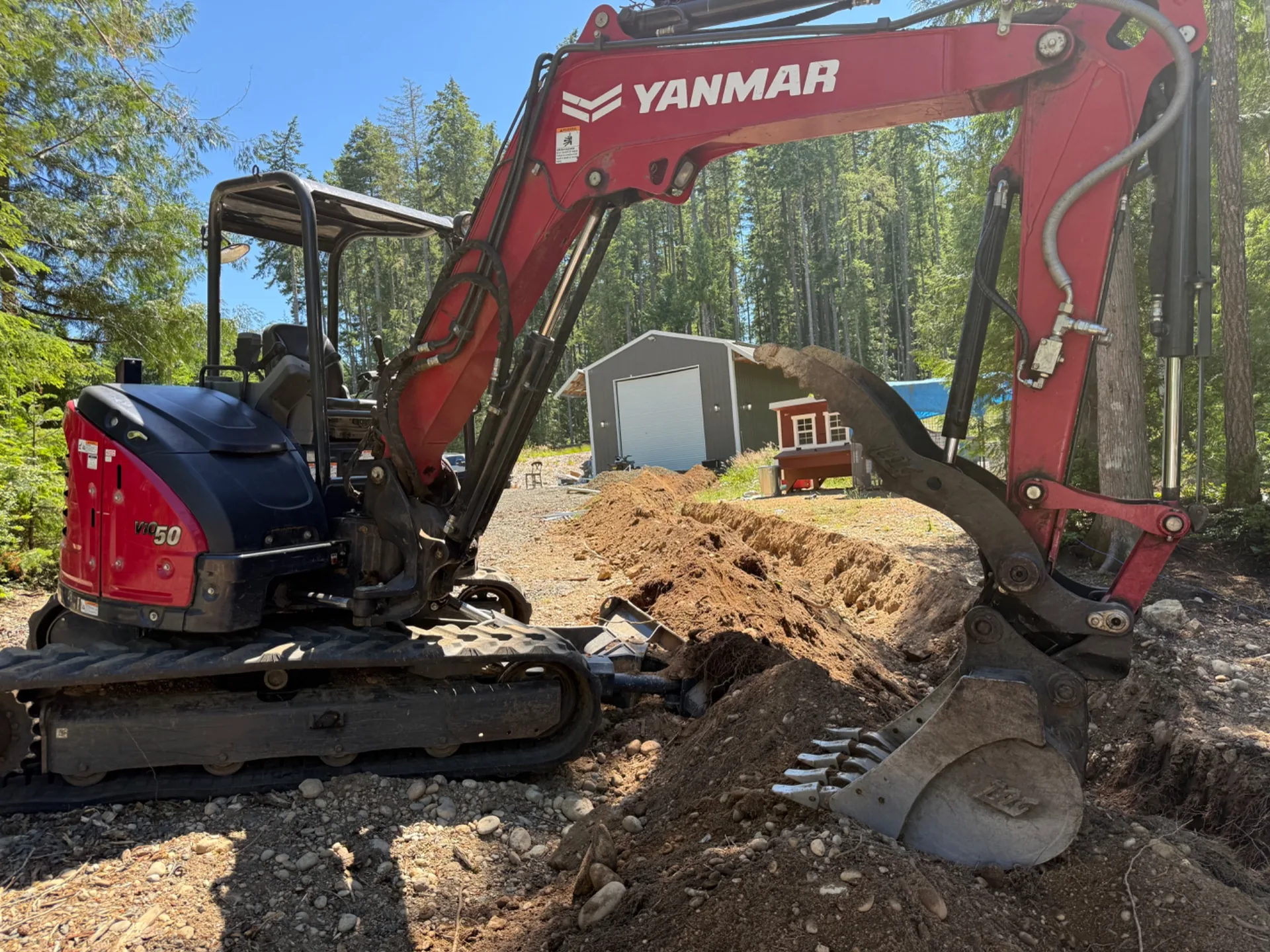Yanmar excavator completing residential excavation work